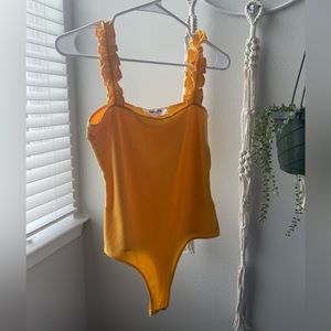 Orange bodysuit!